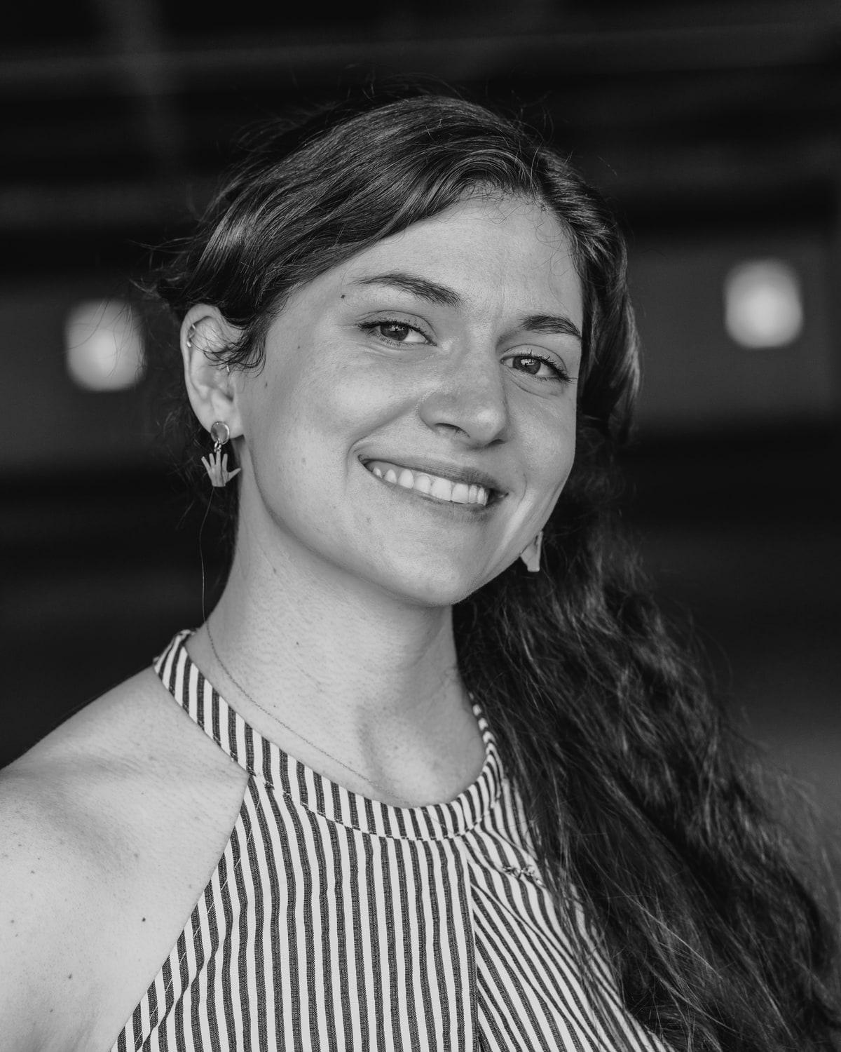Joanie Christiansen of The Untamed Rose, smiling, looking off camera